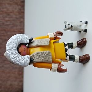 Inuit Eskimo girl with a husky